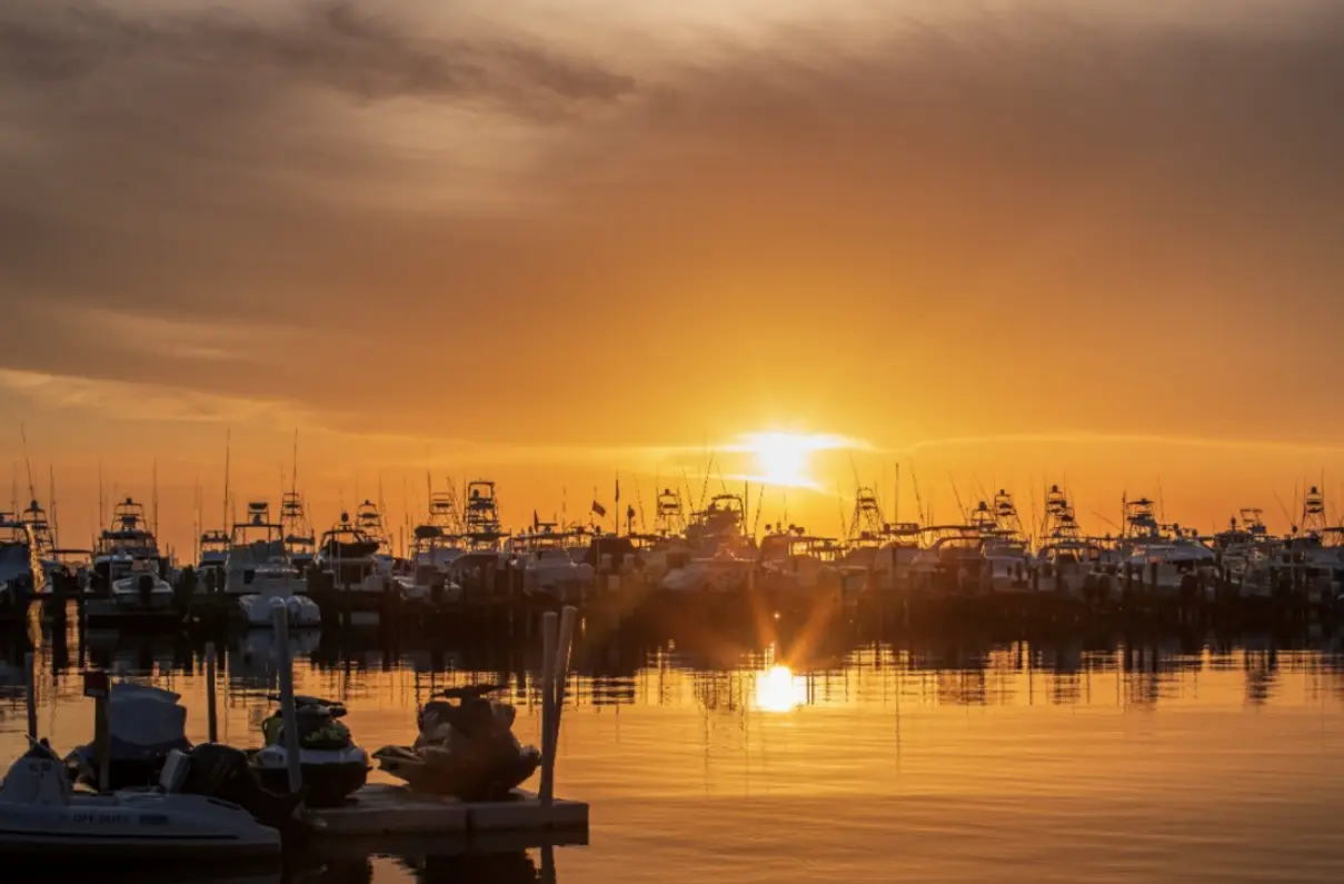 Sunset over the marina at the Village of Baytowne Wharf in Sandestin
