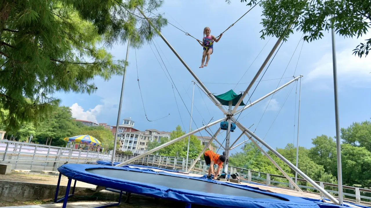 Kid bouncing high on the Eurobungy trampoline at Baytowne Adventure Zone