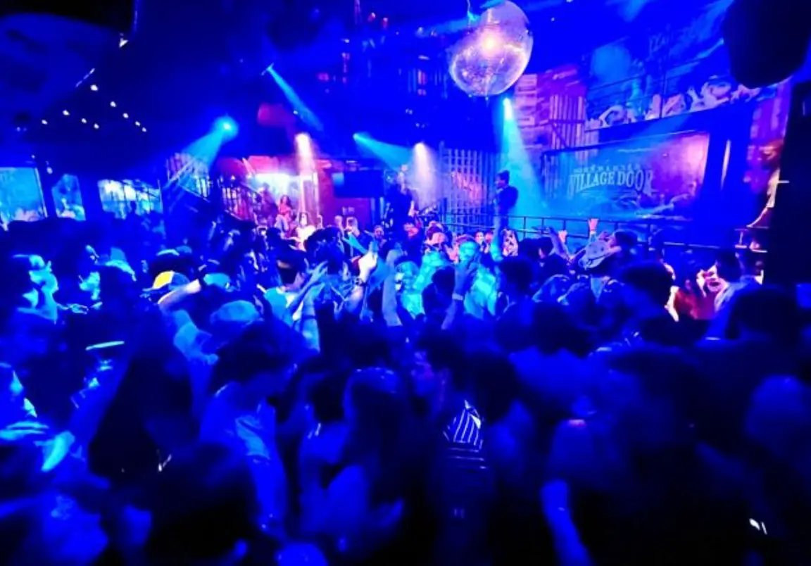 Packed dance floor at the Village Door Dance Club at Baytowne Wharf on a weekend night